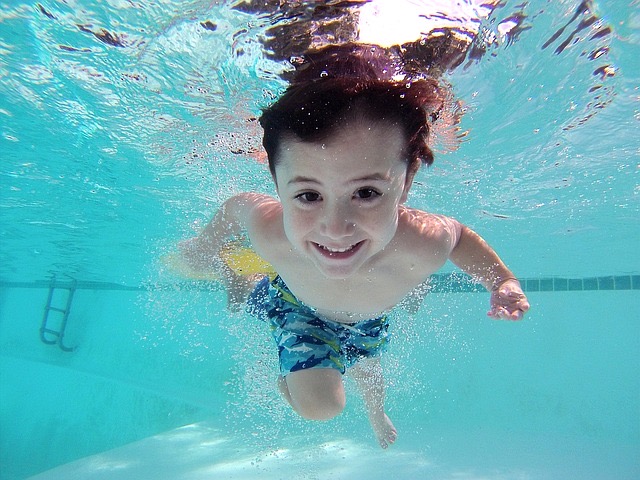 boy swimming in pool