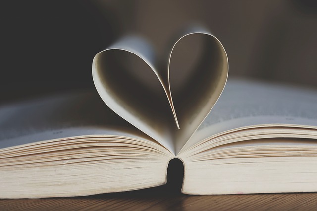 book with some pages folded into a heart 